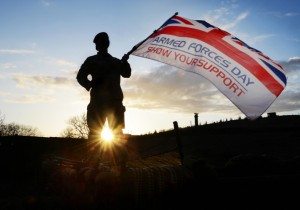 Soldier Waving Armed Forces Day Flag